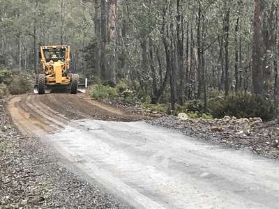 Woods Lake road maintenance Oct 2018 - a large grader in action.